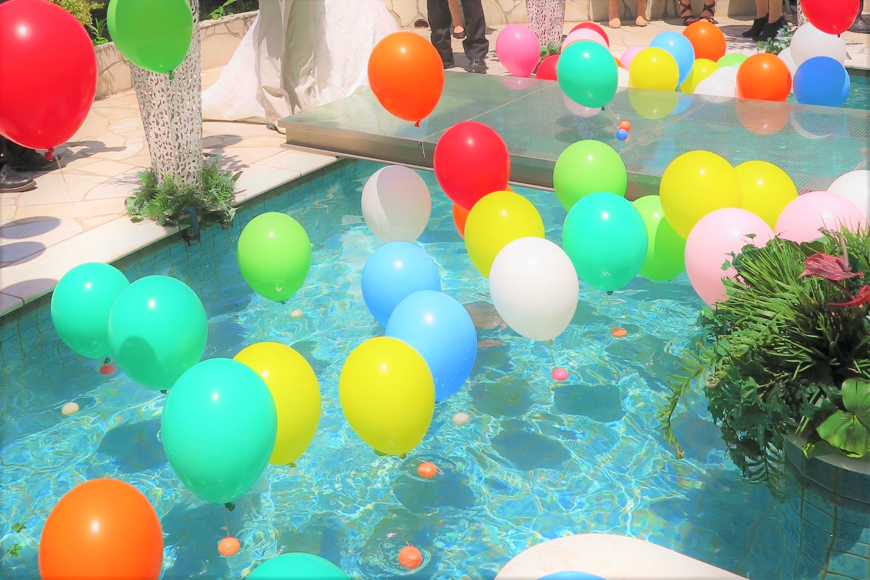 Wedding balloons floating on the water