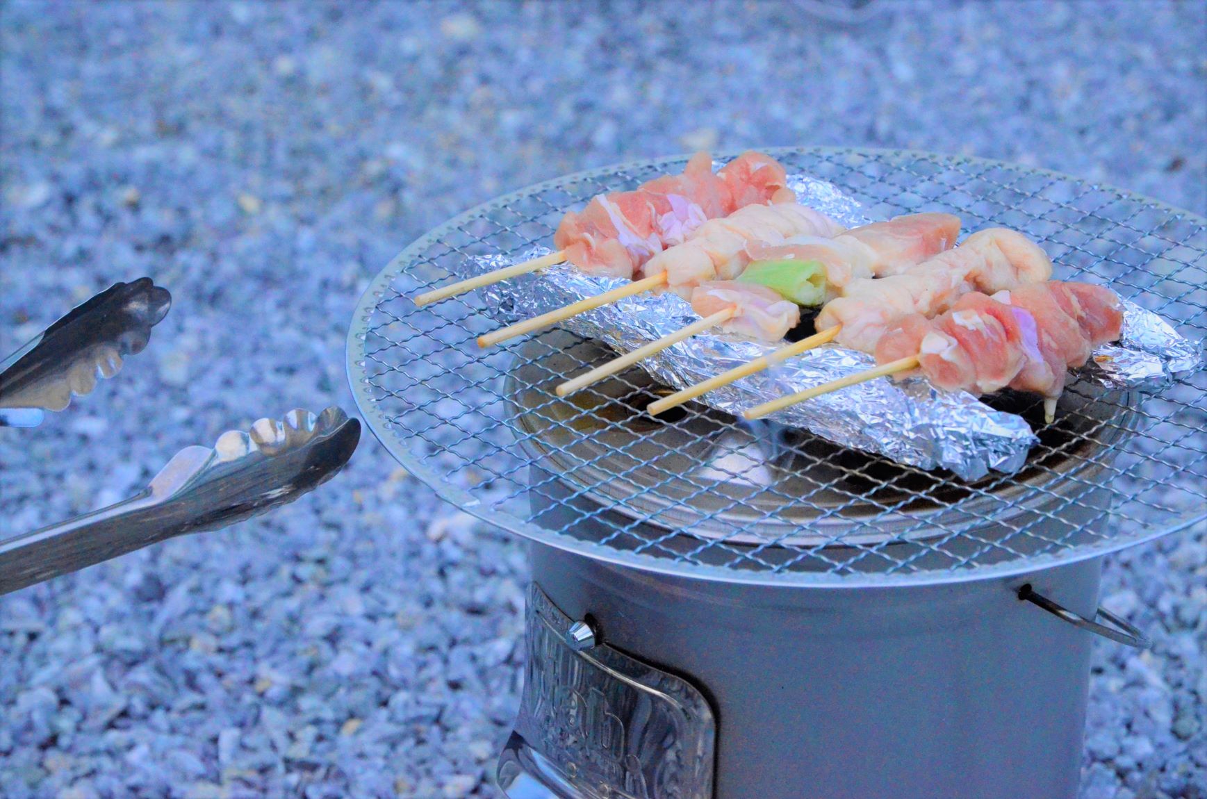 Yakitori cooked on a bonfire stove